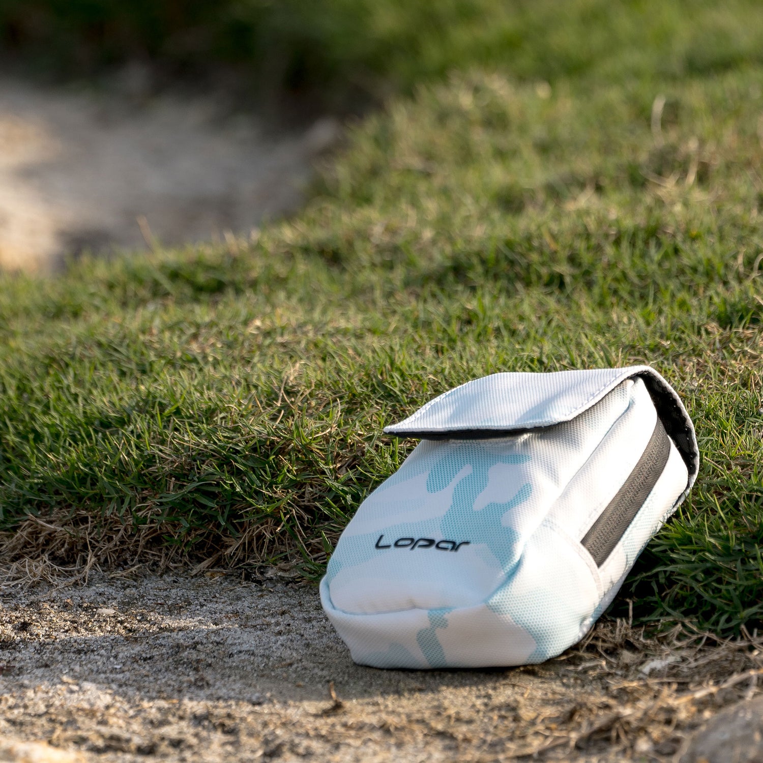 light blue rangefinder case on ground