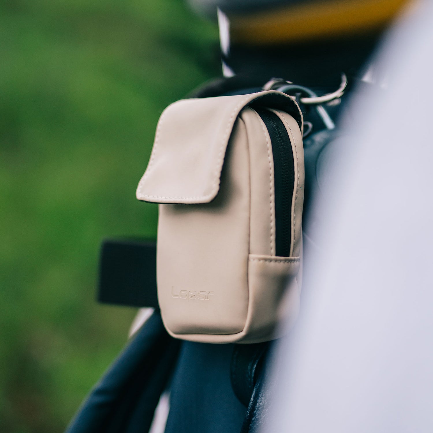 white rangefinder case on bag