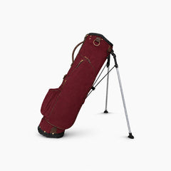 red canvas golf bag standing without any clubs